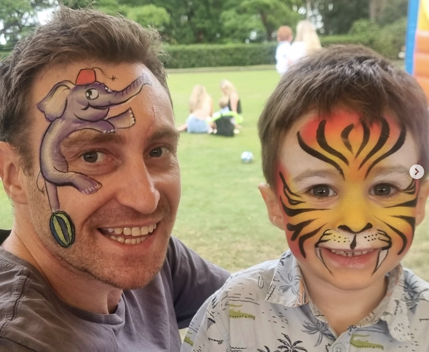 Father and son enjoying face painting at party - family entertainment Sydney